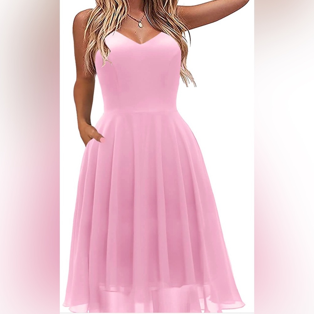 Spaghetti strap pink chiffon dress. It has pockets! Used once.